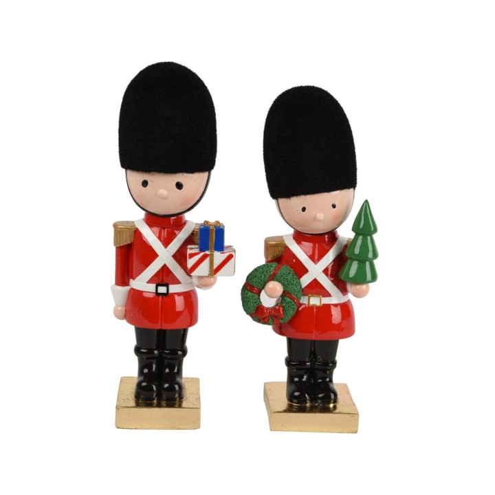 Twee vrolijke soldaatjes in rode uniformen, met zwarte hoeden en kerstaccessoires.