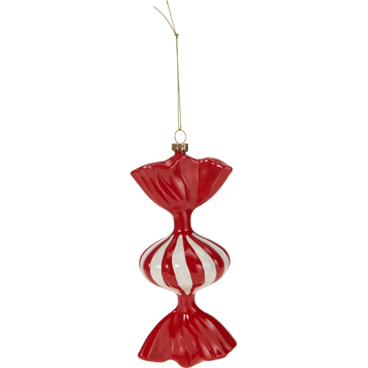 A glossy red and white candy-shaped ornament with a twisted design.