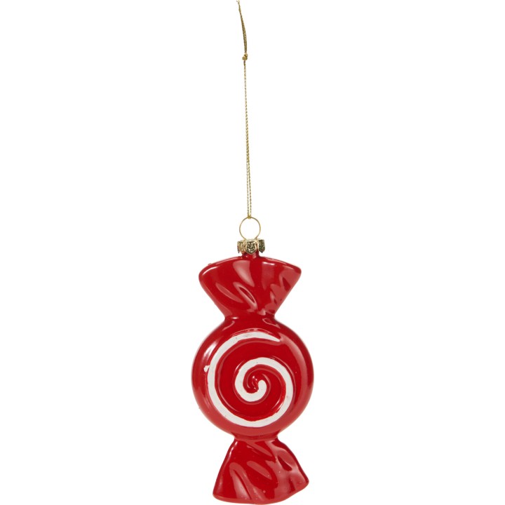 A shiny red ornament shaped like a wrapped candy with a white spiral design.