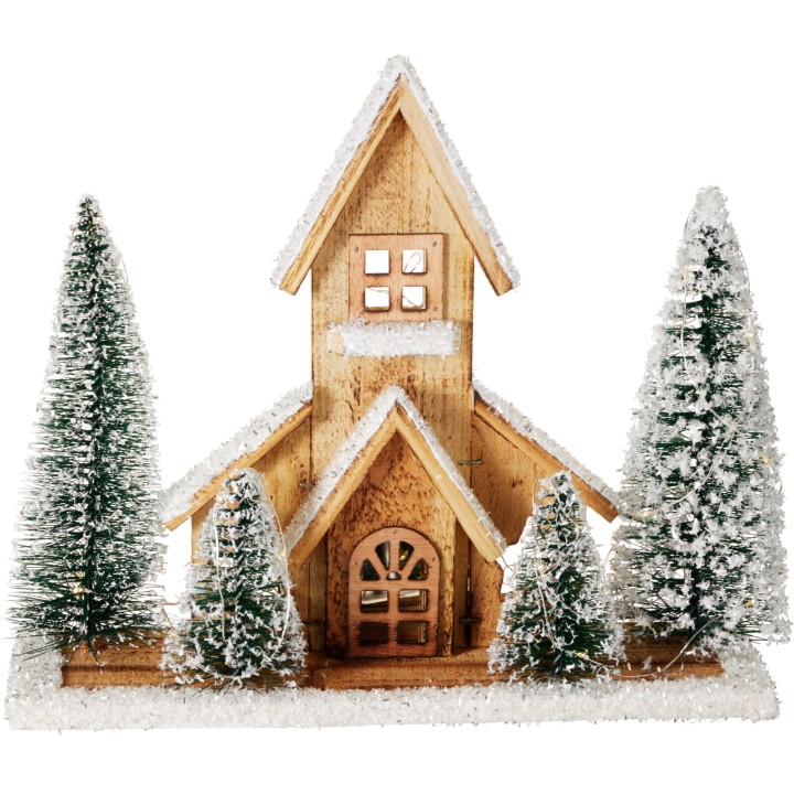 A charming wooden church surrounded by snowy evergreen trees.