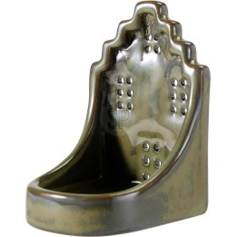 A glossy, dark green ceramic urinal with a unique, sculpted shape.