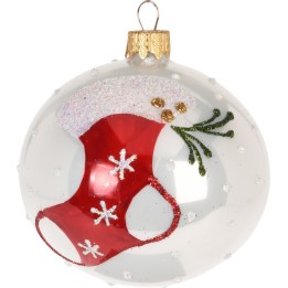 A clear glass ornament featuring a red stocking design with white snowflakes and glitter.