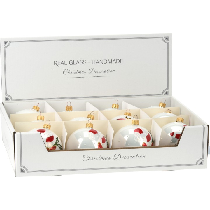 A box of handcrafted glass Christmas ornaments, featuring vibrant red and green designs.