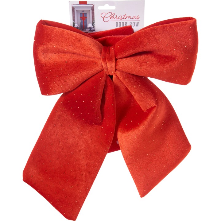 A large, shiny red velvet bow with sparkling accents, perfect for festive decorations.