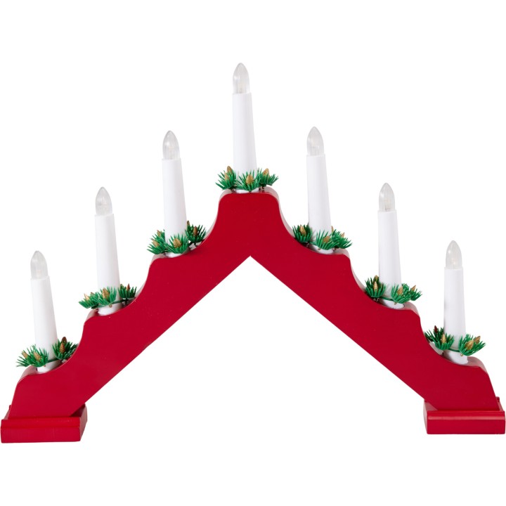 A red wooden candle holder shaped like a mountain, topped with white candles and green accents.
