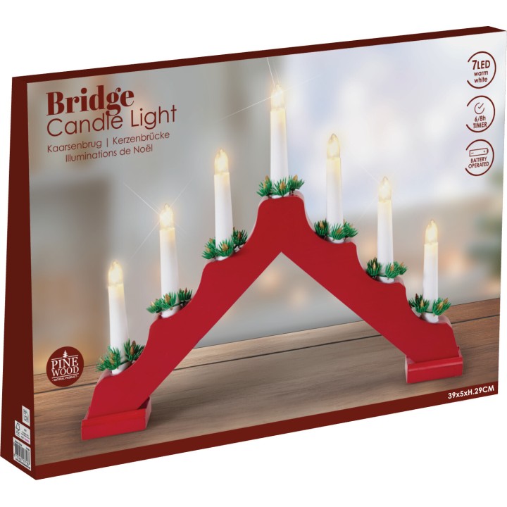 A red wooden candle bridge with seven LED candles and green pine accents.