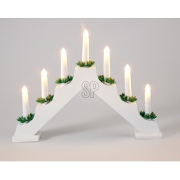A white, arch-shaped candle holder with green accents and seven lit candles.