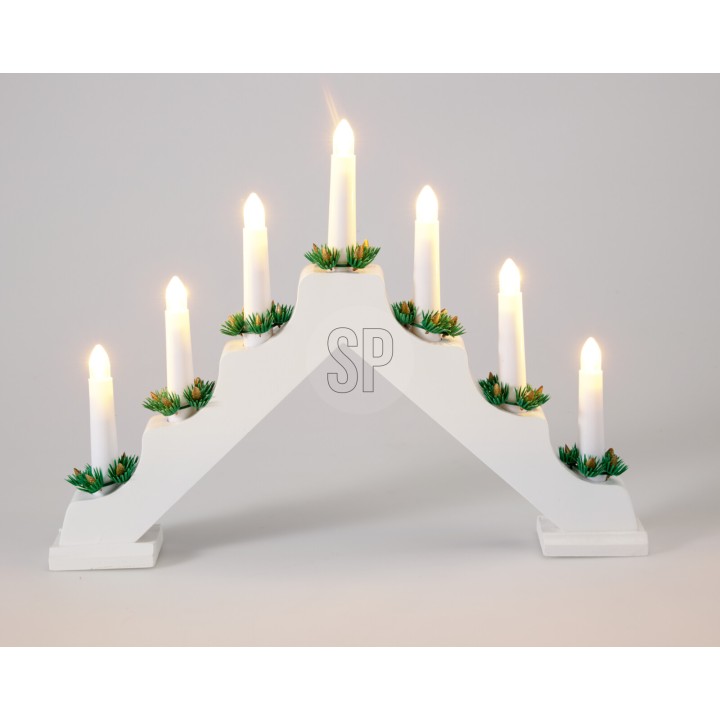 A white, arch-shaped candle holder with green accents and seven lit candles.