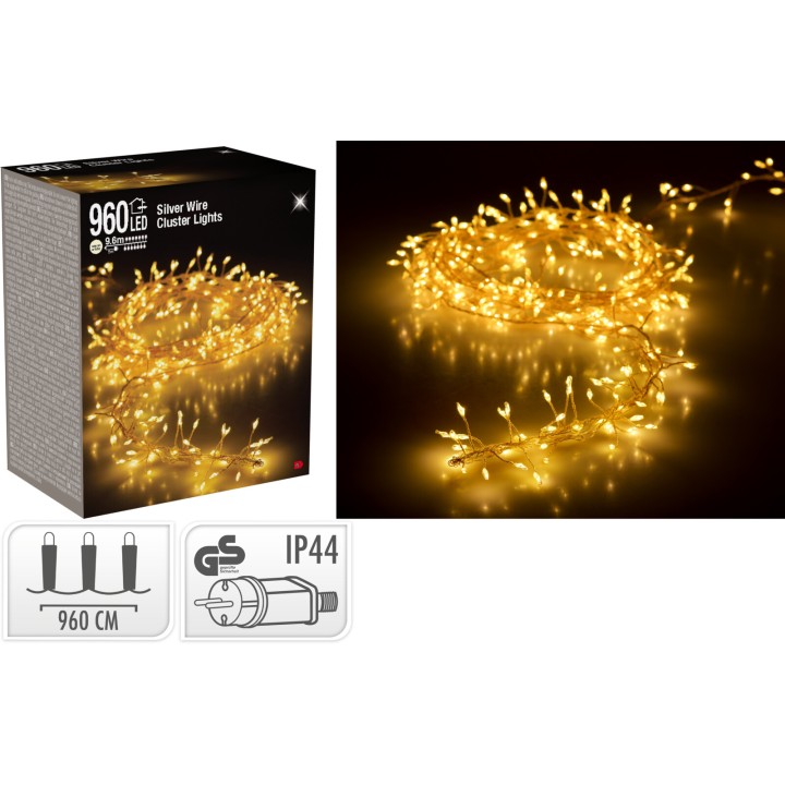 A tangled string of warm white LED lights on silver wire, emitting a soft glow.