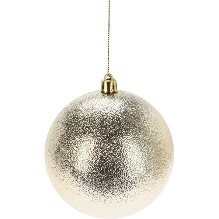 A shiny, textured gold ornament hangs from a thin golden string.