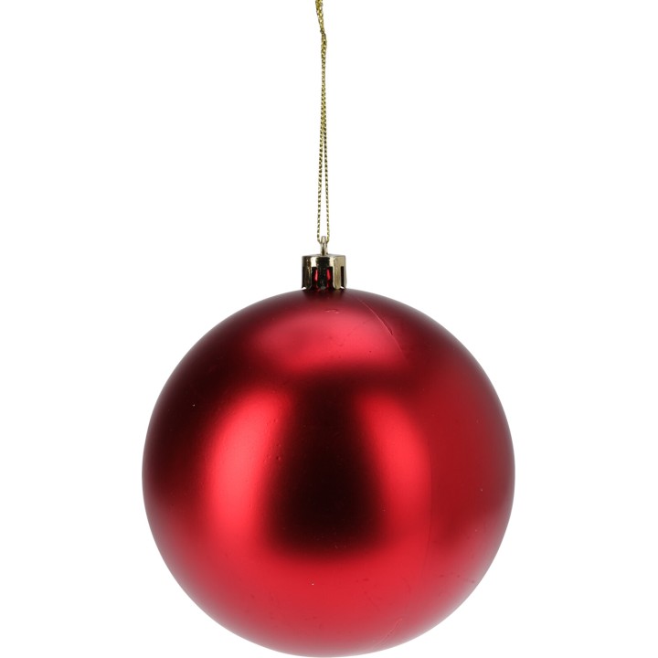 Shiny red Christmas ornament, round and smooth, hanging by a gold thread.