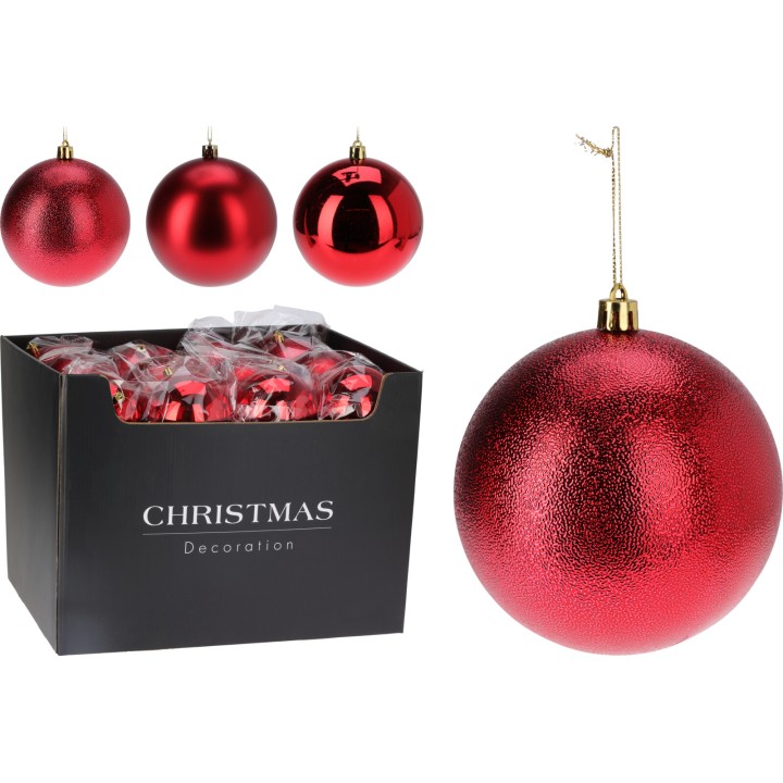 Shiny red Christmas ornaments in a black box, featuring various sizes and textures.