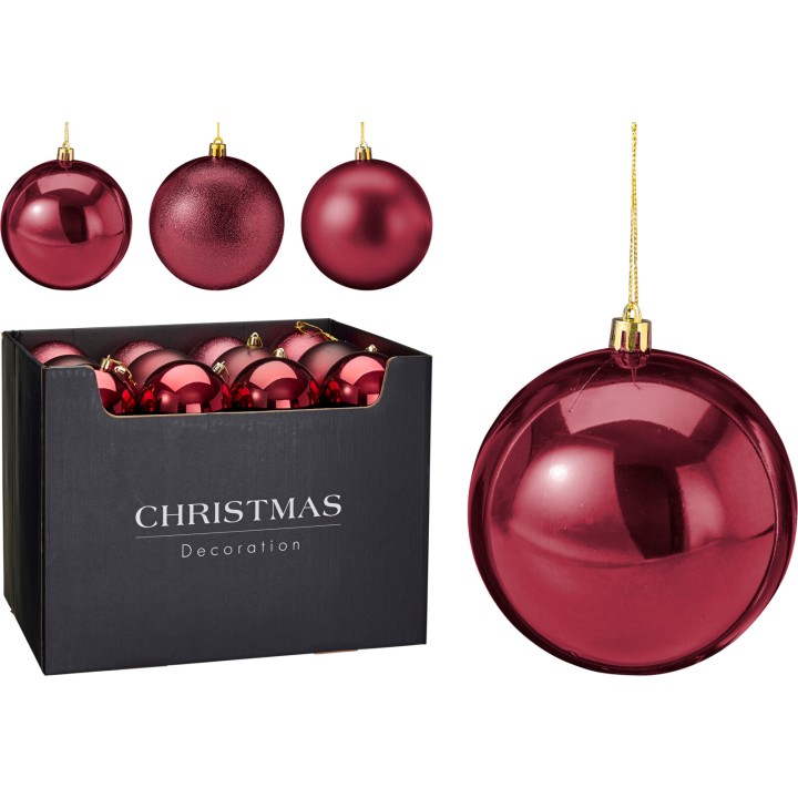 Shiny red Christmas ornaments in a black box, featuring various round shapes and textures.