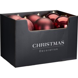 A black box filled with shiny and textured red Christmas ornaments.