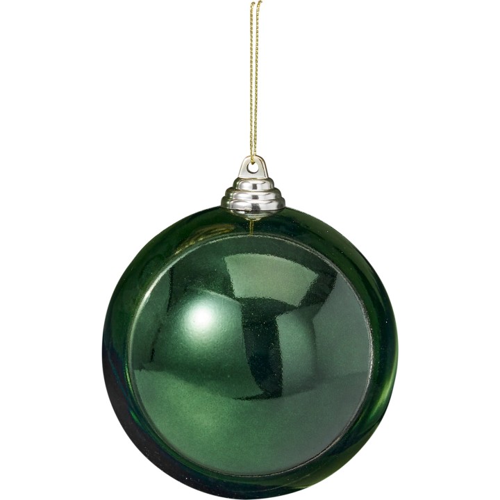 A shiny green glass Christmas ornament with a silver cap and a golden hanging string.