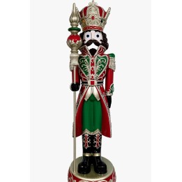 A colorful nutcracker figure in royal attire, adorned with intricate patterns and a crown.