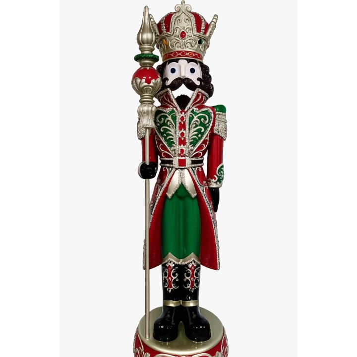 A colorful nutcracker figure in royal attire, adorned with intricate patterns and a crown.