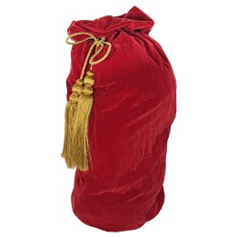 A plush red velvet bag tied with a golden cord and tassels, exuding elegance.