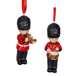 Two festive ornaments of toy soldiers in red uniforms, one playing a trumpet and the other a drum.