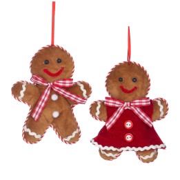 Two plush gingerbread figures, one in a dress and the other in a bow tie, with cheerful smiles.