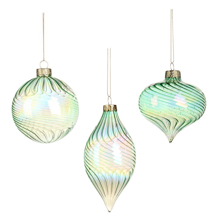 Three iridescent glass ornaments in soft green, showcasing swirling patterns and elegant shapes.