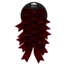 Zevenset dieprode fluwelen strikken op een zwarte kaart, elegant en luxe uitstraling.
