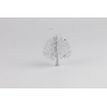 A delicate, white metal tree sculpture with intricate leaf designs and a minimalistic style.
